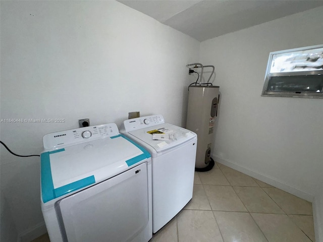 433 SW 28th Ave, Fort Lauderdale, FL 33312 - laundry area featuring washing machine and dryer, electric water heater, and light tile patterned flooring