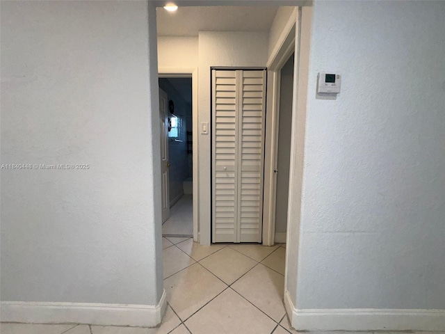 433 SW 28th Ave, Fort Lauderdale, FL 33312 - hall featuring baseboards and light tile patterned flooring