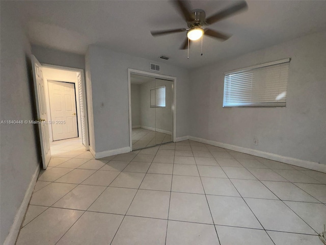 433 SW 28th Ave, Fort Lauderdale, FL 33312 - unfurnished bedroom with light tile patterned flooring, a closet, and a ceiling fan