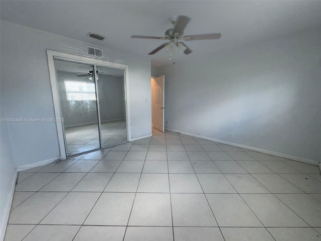 433 SW 28th Ave, Fort Lauderdale, FL 33312 - unfurnished bedroom with a closet, ceiling fan, and light tile patterned floors