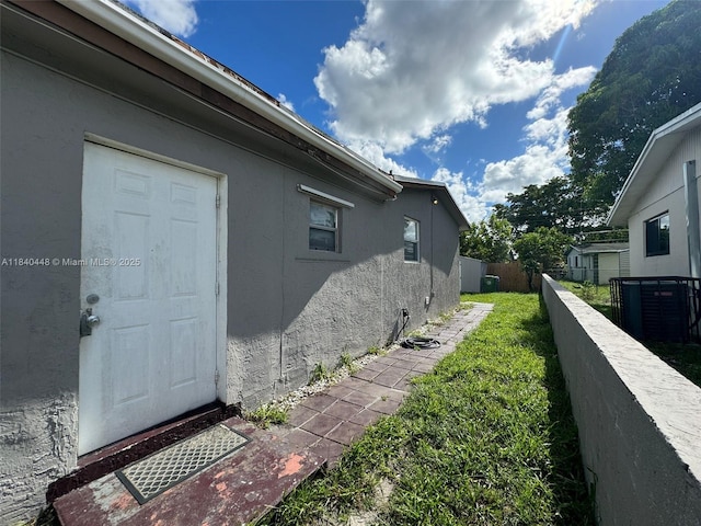 433 SW 28th Ave, Fort Lauderdale, FL 33312 - view of property exterior with stucco siding and a central AC unit