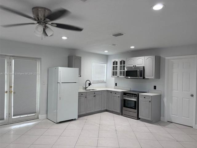 433 SW 28th Ave, Fort Lauderdale, FL 33312 - kitchen with appliances with stainless steel finishes, gray cabinets, ceiling fan, light countertops, and recessed lighting