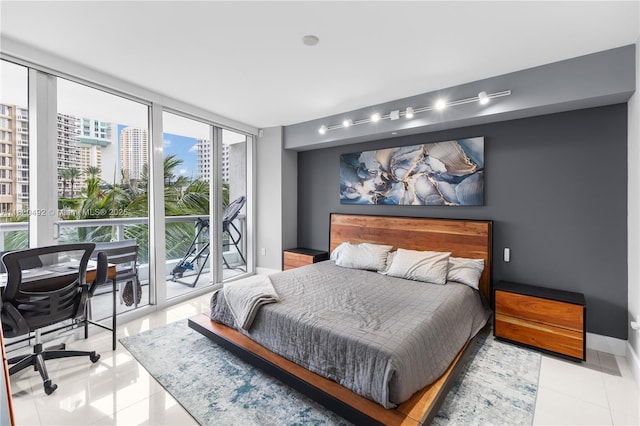 465 Brickell Ave Unit 417, Miami, FL 33131 - tiled bedroom featuring floor to ceiling windows, an office area, and access to outside