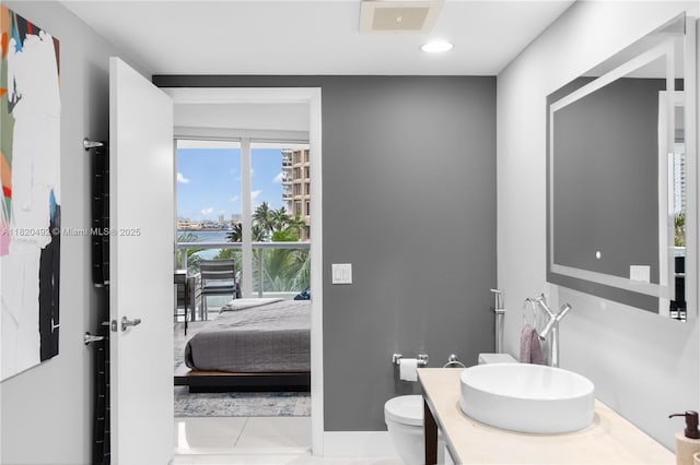 465 Brickell Ave Unit 417, Miami, FL 33131 - bathroom with vanity, a water view, tile patterned flooring, and recessed lighting