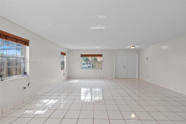 7767 NW 187th Ter, Miami, FL 33015 - unfurnished room with light tile patterned flooring