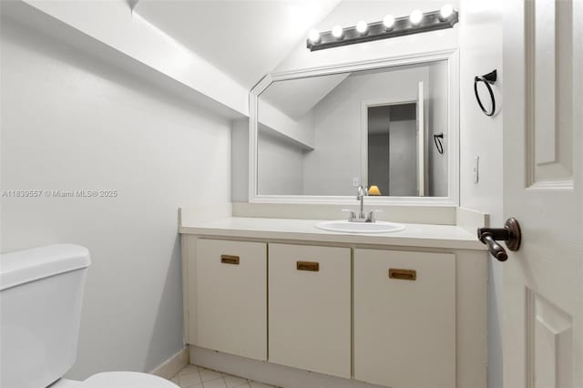 7767 NW 187th Ter, Miami, FL 33015 - half bath featuring vanity, lofted ceiling, and tile patterned floors