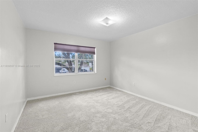 7767 NW 187th Ter, Miami, FL 33015 - carpeted empty room with a textured ceiling and baseboards