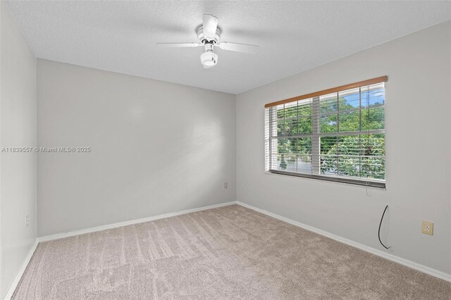 7767 NW 187th Ter, Miami, FL 33015 - carpeted spare room featuring a ceiling fan and a textured ceiling