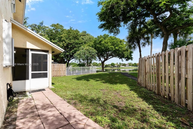 7767 NW 187th Ter, Miami, FL 33015 - fenced backyard featuring a sunroom