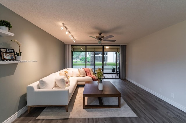 7625 NW 79th Ave Unit 101, Tamarac, FL 33321 - living room with a textured ceiling, a ceiling fan, and wood finished floors