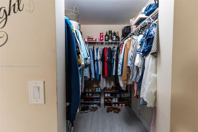 7625 NW 79th Ave Unit 101, Tamarac, FL 33321 - spacious closet featuring wood finished floors