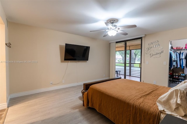 7625 NW 79th Ave Unit 101, Tamarac, FL 33321 - bedroom with access to outside, wood finished floors, a spacious closet, and ceiling fan