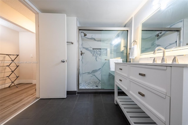 7625 NW 79th Ave Unit 101, Tamarac, FL 33321 - full bath featuring vanity, a marble finish shower, and tile patterned flooring