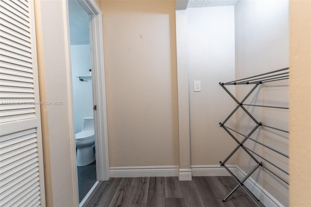 7625 NW 79th Ave Unit 101, Tamarac, FL 33321 - hallway with wood finished floors and baseboards