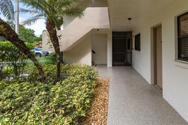 7625 NW 79th Ave Unit 101, Tamarac, FL 33321 - property entrance with stucco siding