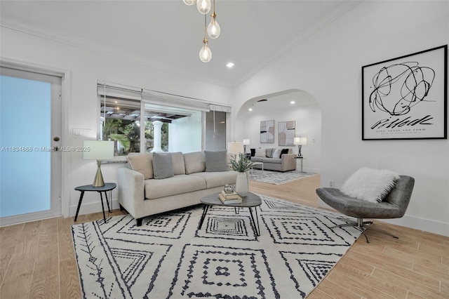 5701 SW 33rd St, Miami, FL 33155 - living room with crown molding, arched walkways, wood finished floors, and lofted ceiling