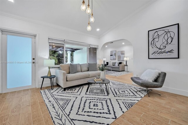 5701 SW 33rd St, Miami, FL 33155 - living area featuring arched walkways, lofted ceiling, ornamental molding, light wood-type flooring, and recessed lighting