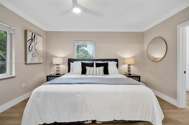 5701 SW 33rd St, Miami, FL 33155 - bedroom with multiple windows, wood finished floors, ceiling fan, and ornamental molding