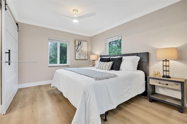 5701 SW 33rd St, Miami, FL 33155 - bedroom featuring a barn door, light wood finished floors, crown molding, and a ceiling fan