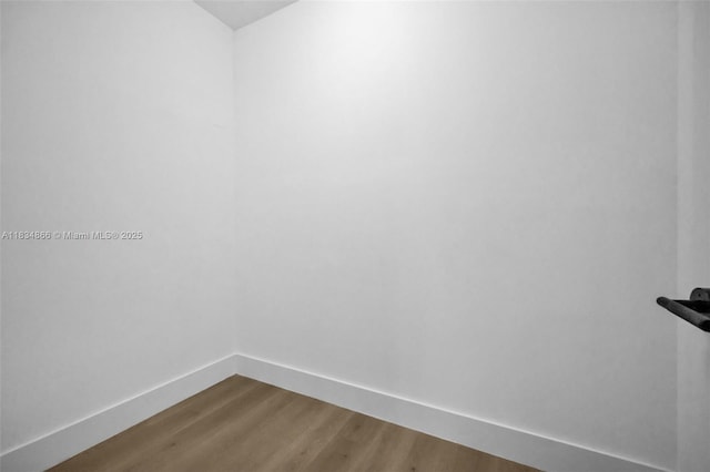 5701 SW 33rd St, Miami, FL 33155 - unfurnished room with baseboards and dark wood-style flooring