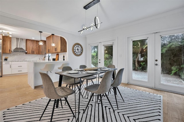 5701 SW 33rd St, Miami, FL 33155 - dining room featuring french doors, ornamental molding, light wood finished floors, and a chandelier
