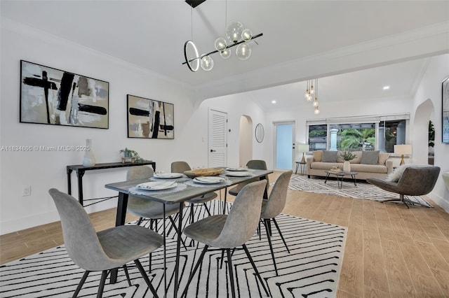 5701 SW 33rd St, Miami, FL 33155 - dining room with arched walkways, a chandelier, light wood-style floors, crown molding, and recessed lighting