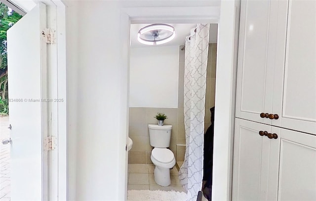 5701 SW 33rd St, Miami, FL 33155 - full bath featuring tile walls, curtained shower, and tile patterned floors