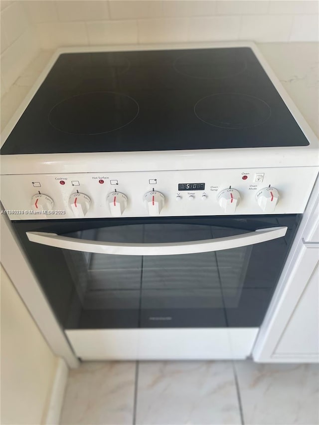 3401 SW 11th St Unit 1B, Miami, FL 33135 - kitchen view of white range with electric stovetop