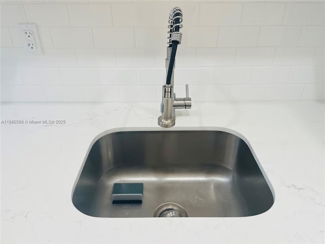 3401 SW 11th St Unit 1B, Miami, FL 33135 - kitchen view of a sink and light stone countertops