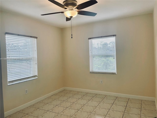 3401 SW 11th St Unit 1B, Miami, FL 33135 - spare room featuring a ceiling fan and baseboards
