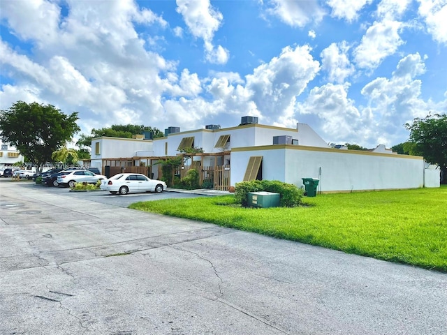 1725 SW 131st Place Cir S, Miami, FL 33175 - view of home's exterior with uncovered parking and stucco siding
