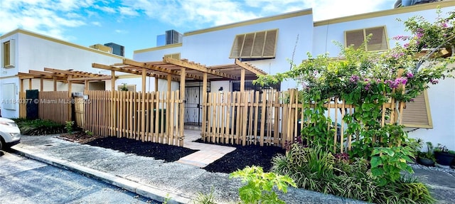 1725 SW 131st Place Cir S, Miami, FL 33175 - back of property with a pergola and stucco siding