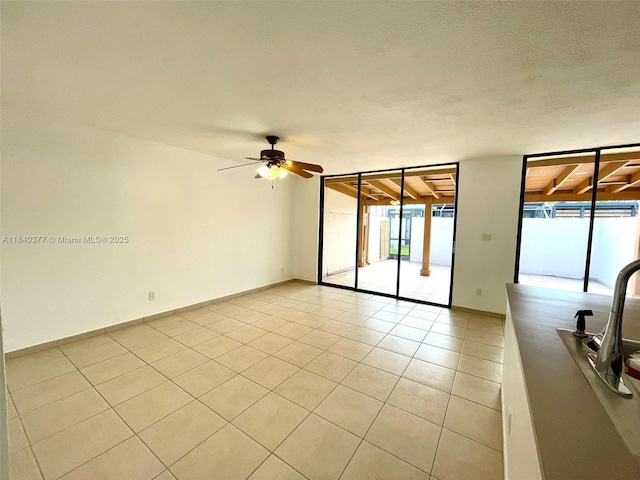 1725 SW 131st Place Cir S, Miami, FL 33175 - empty room with light tile patterned flooring and a ceiling fan