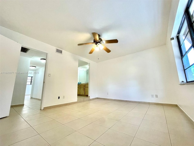 1725 SW 131st Place Cir S, Miami, FL 33175 - empty room with a ceiling fan and light tile patterned floors