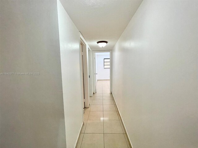1725 SW 131st Place Cir S, Miami, FL 33175 - hallway featuring light tile patterned floors and baseboards