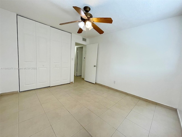 1725 SW 131st Place Cir S, Miami, FL 33175 - unfurnished bedroom featuring light tile patterned floors, a closet, and ceiling fan
