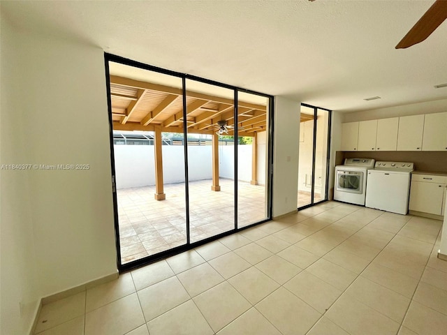 1725 SW 131st Place Cir S, Miami, FL 33175 - interior space with washer and dryer, a ceiling fan, light tile patterned floors, and floor to ceiling windows