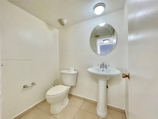 1725 SW 131st Place Cir S, Miami, FL 33175 - half bathroom with tile patterned flooring and a textured ceiling