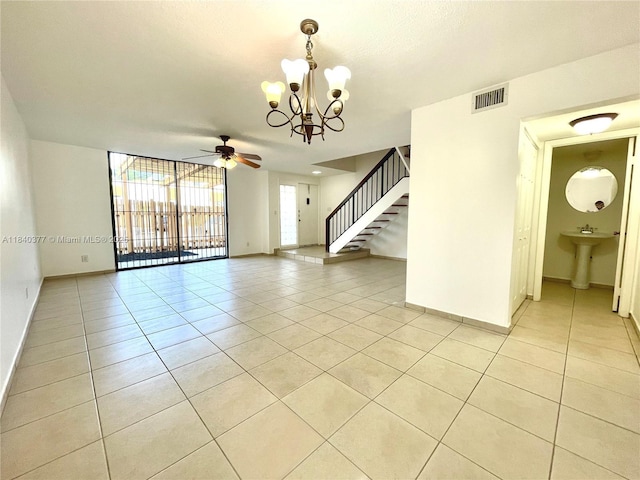 1725 SW 131st Place Cir S, Miami, FL 33175 - spare room with light tile patterned floors, a chandelier, stairway, and ceiling fan