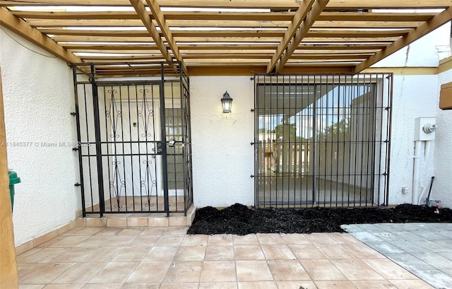 1725 SW 131st Place Cir S, Miami, FL 33175 - property entrance with stucco siding and a pergola