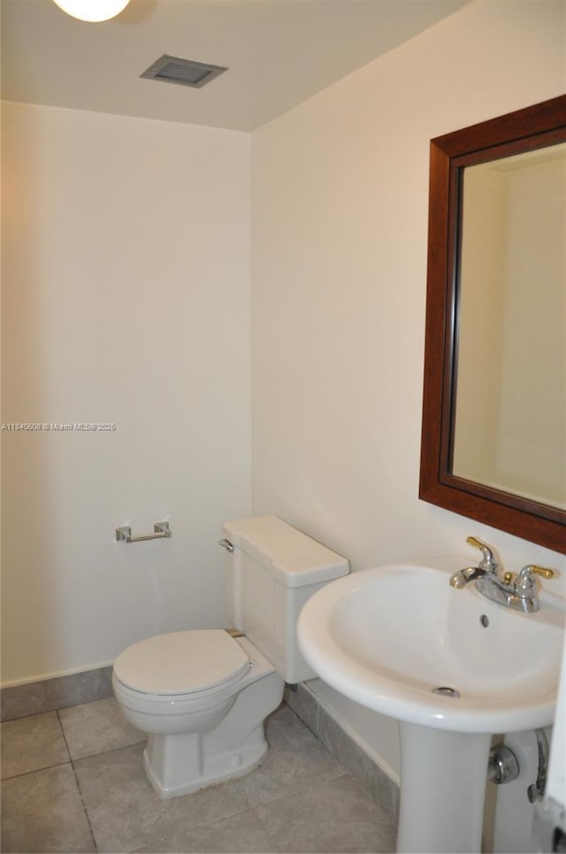 13499 Biscayne Blvd Unit 1011, North Miami, FL 33181 - bathroom featuring toilet and tile patterned flooring
