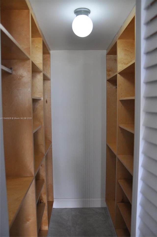 13499 Biscayne Blvd Unit 1011, North Miami, FL 33181 - spacious closet with dark tile patterned flooring