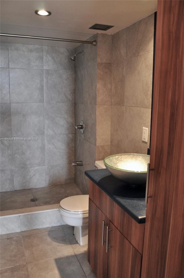 13499 Biscayne Blvd Unit 1011, North Miami, FL 33181 - full bathroom featuring vanity, a tile shower, tile walls, recessed lighting, and tile patterned floors
