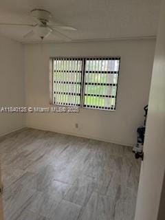 4760 W Lucerne Lakes Blvd W Unit 108, Lake Worth, FL 33467 - unfurnished room featuring plenty of natural light, ceiling fan, and wood finished floors