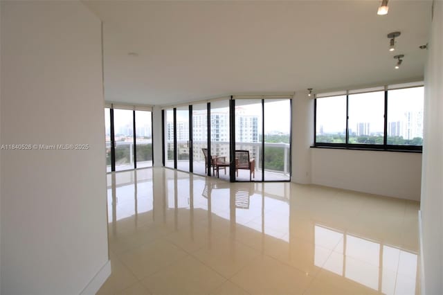 20185 E Country Club Dr Unit 1105, Aventura, FL 33180 - tiled empty room with floor to ceiling windows