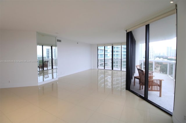 20185 E Country Club Dr Unit 1105, Aventura, FL 33180 - empty room featuring floor to ceiling windows and light tile patterned floors