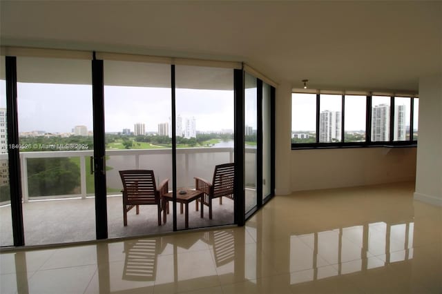 20185 E Country Club Dr Unit 1105, Aventura, FL 33180 - sunroom featuring a city view and tile patterned flooring