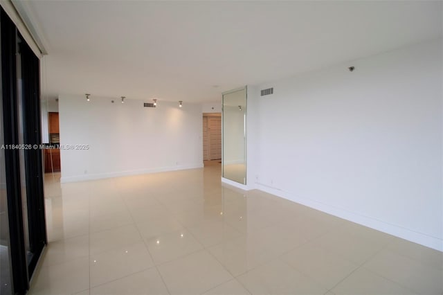 20185 E Country Club Dr Unit 1105, Aventura, FL 33180 - empty room with light tile patterned floors and baseboards