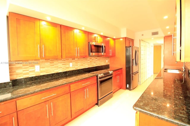 20185 E Country Club Dr Unit 1105, Aventura, FL 33180 - kitchen featuring stainless steel appliances, dark stone countertops, backsplash, and recessed lighting