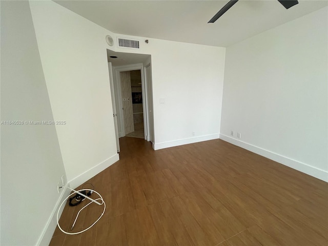 20185 E Country Club Dr Unit 1105, Aventura, FL 33180 - empty room with ceiling fan and dark wood-type flooring